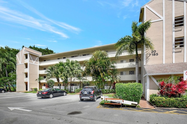 7185 Huntington Ln Unit 301, Delray Beach, FL 33446 - view of building exterior with uncovered parking
