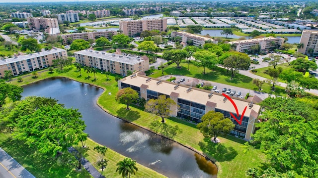 birds eye view of property with a water view