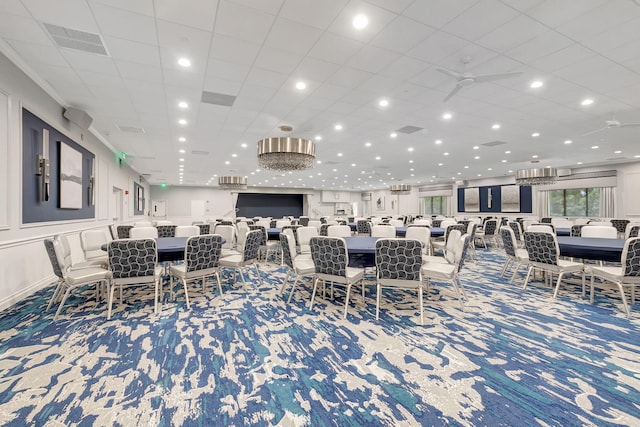 dining space featuring ceiling fan and carpet floors