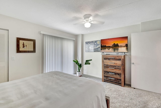 7185 Huntington Ln Unit 301, Delray Beach, FL 33446 - bedroom with ceiling fan, carpet, baseboards, and a textured ceiling