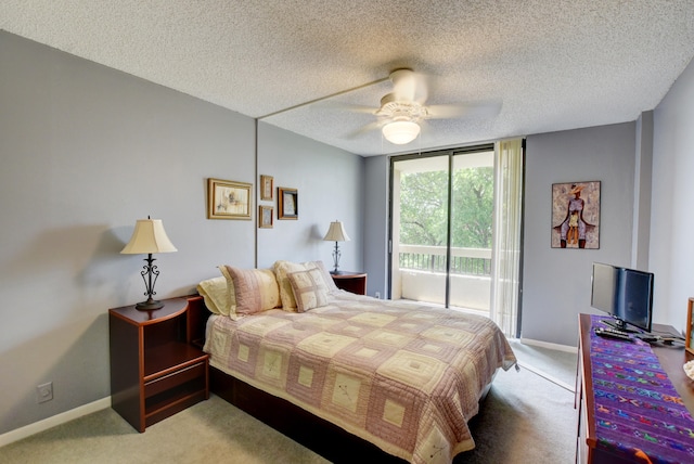 bedroom featuring a textured ceiling, ceiling fan, light carpet, and access to outside