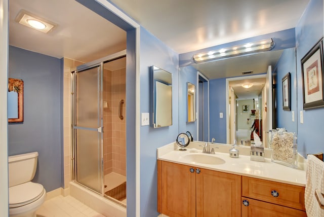 bathroom featuring walk in shower, toilet, tile flooring, and vanity