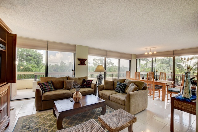 living room with a wealth of natural light, a textured ceiling, rail lighting, and light tile floors