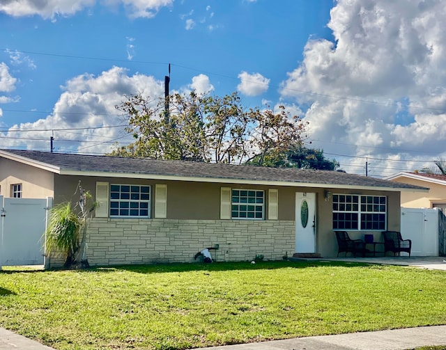 ranch-style home with a front yard