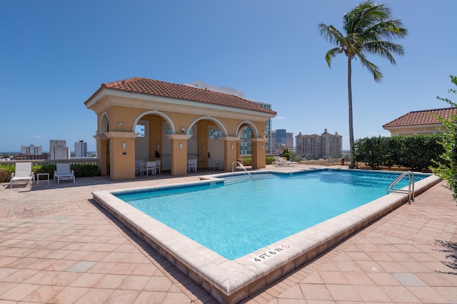 view of swimming pool with a patio area