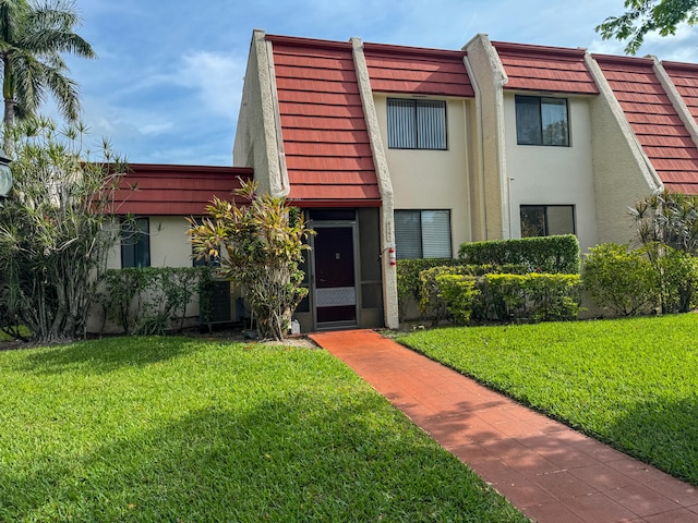 view of front of property with a front lawn