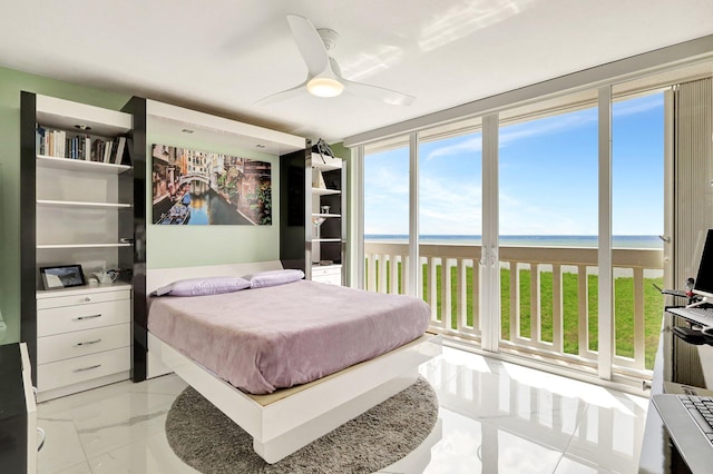 tiled home office with floor to ceiling windows and ceiling fan