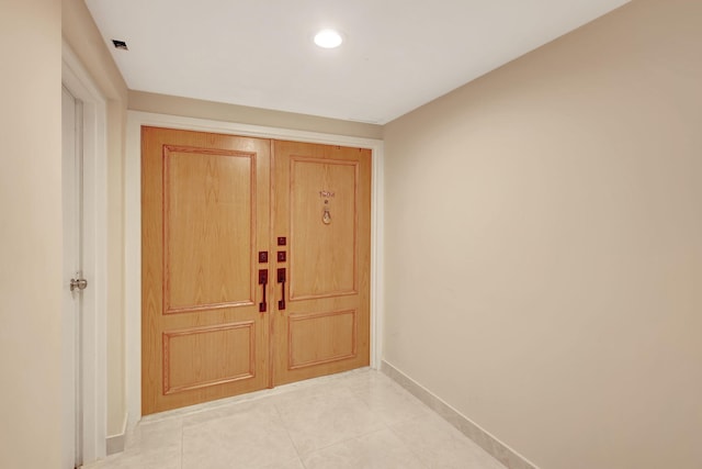 hallway featuring elevator and crown molding