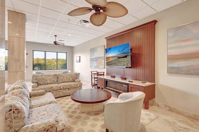 dining space with a paneled ceiling