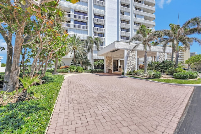 view of property with a view of the beach and a water view