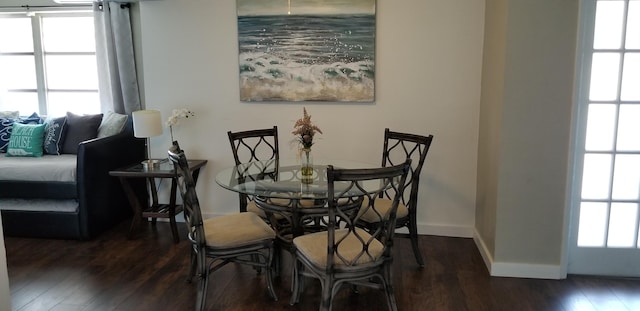 dining area with dark hardwood / wood-style floors