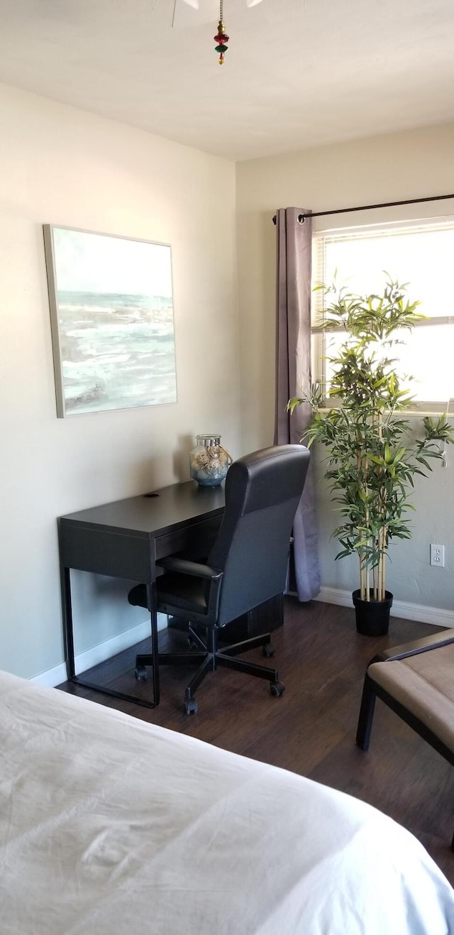 office space with dark wood-type flooring