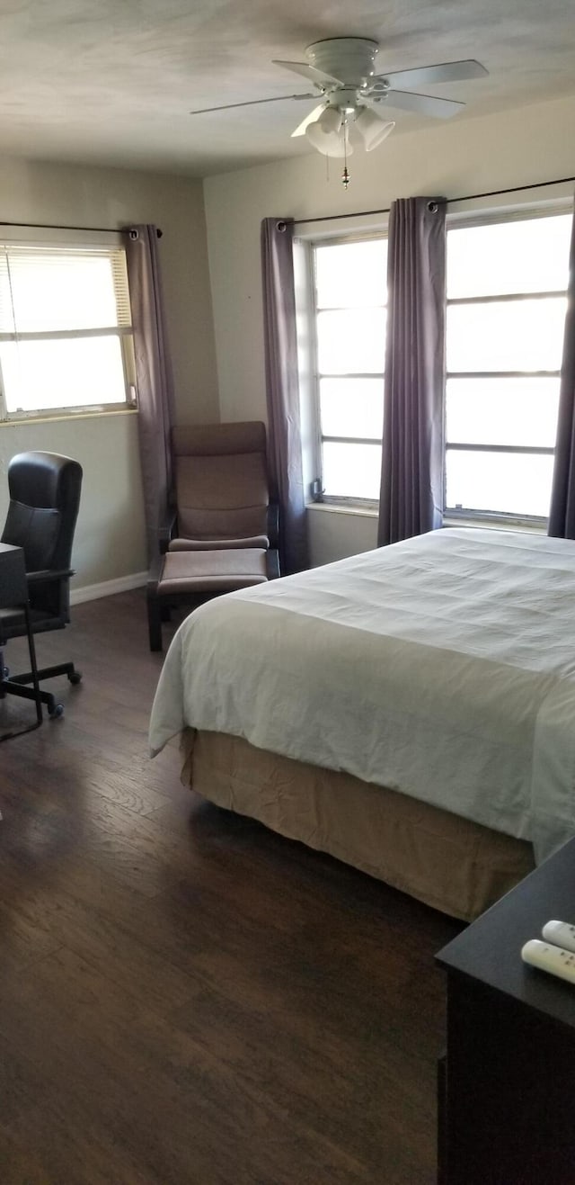 bedroom featuring ceiling fan and dark hardwood / wood-style flooring