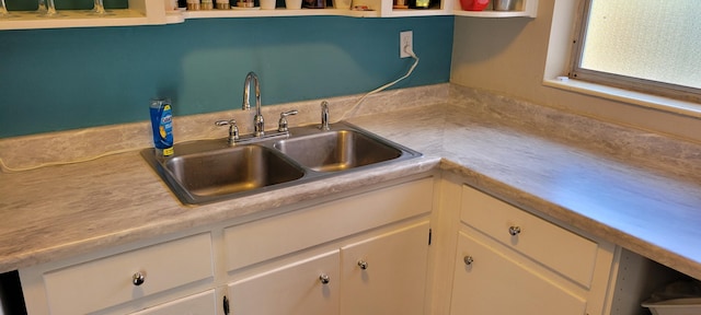 kitchen with white cabinets and sink