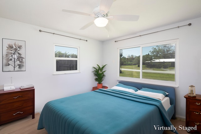 bedroom featuring ceiling fan and light wood-type flooring