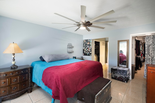 tiled bedroom featuring a closet and ceiling fan