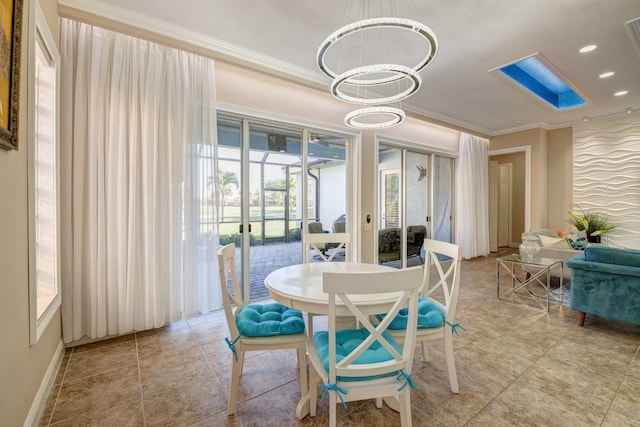 dining room with ornamental molding, a notable chandelier, light tile floors, and a wealth of natural light