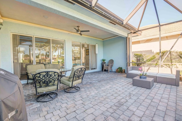 view of terrace with an outdoor living space and ceiling fan