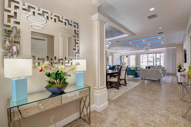 interior space featuring ornate columns and light tile flooring