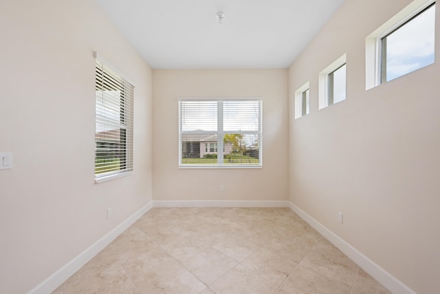 empty room with light tile floors