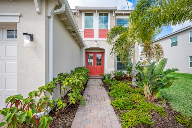 property entrance with french doors and a garage