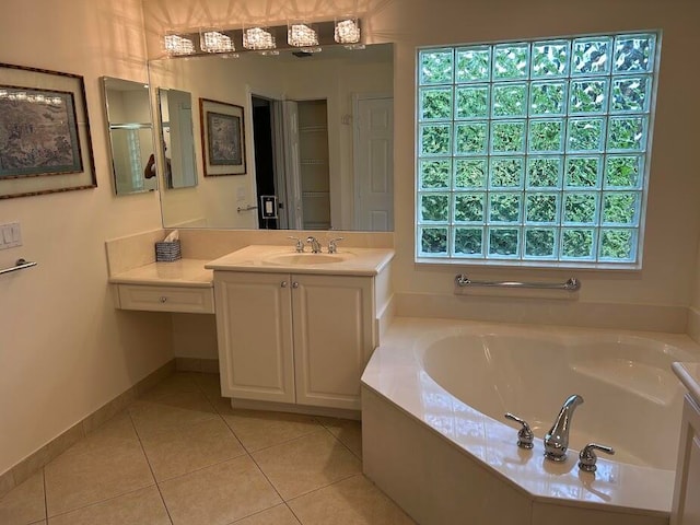 bathroom with tile patterned flooring, plenty of natural light, independent shower and bath, and vanity