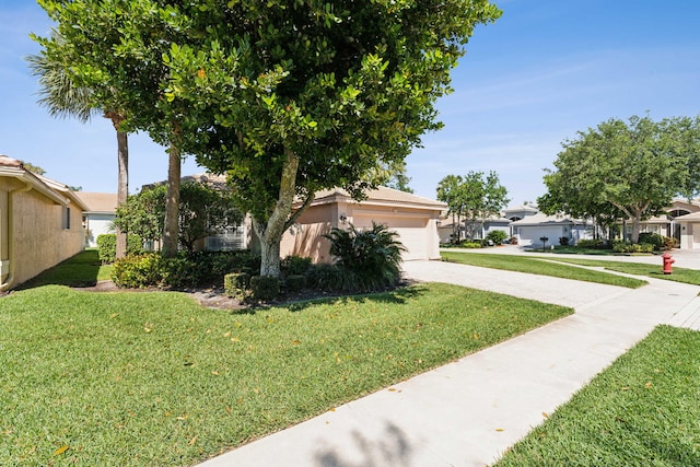 exterior space with a front yard and a garage