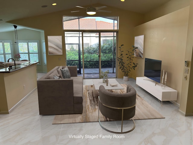 living room featuring ceiling fan and vaulted ceiling