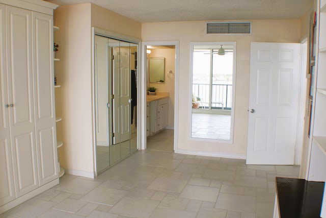 interior space featuring light tile floors