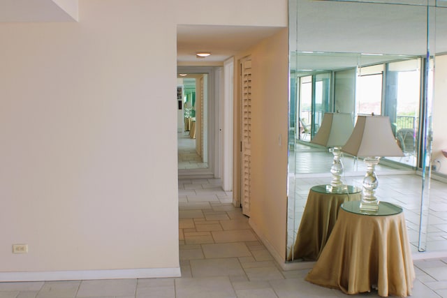 hallway with light tile floors