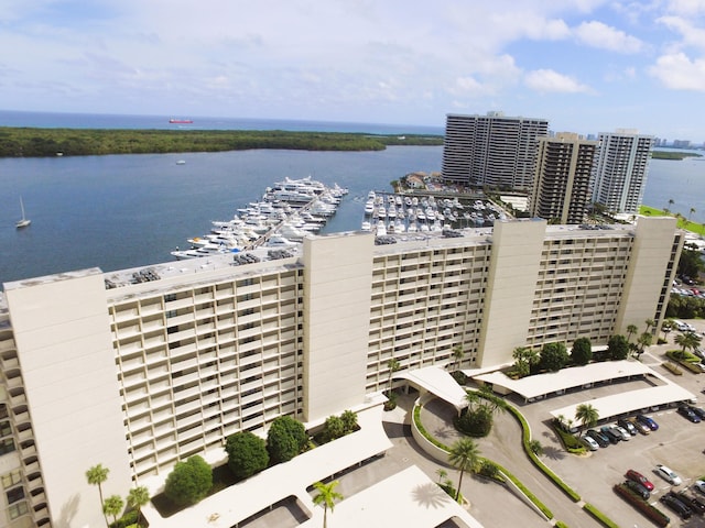 birds eye view of property with a water view