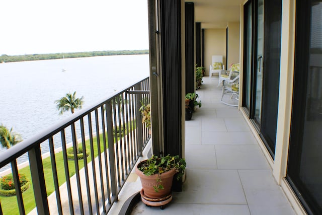 balcony featuring a water view