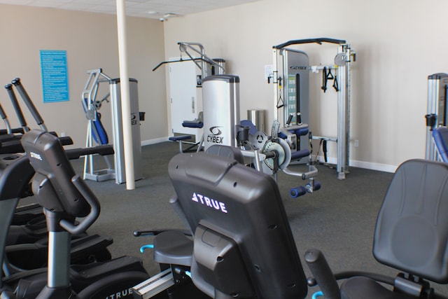 workout area featuring dark carpet