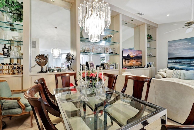 dining space featuring ceiling fan with notable chandelier and wood-type flooring