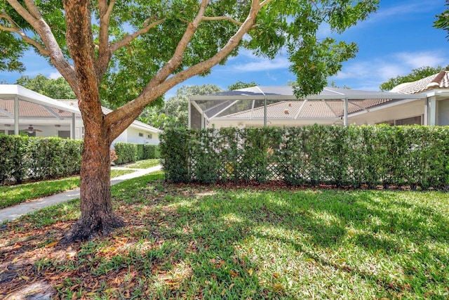 view of yard featuring a lanai