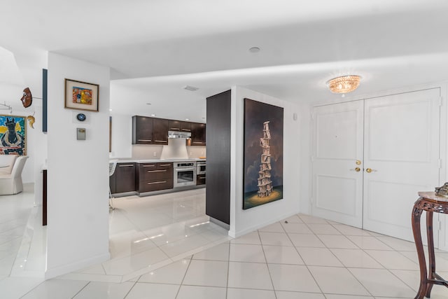 foyer with light tile floors