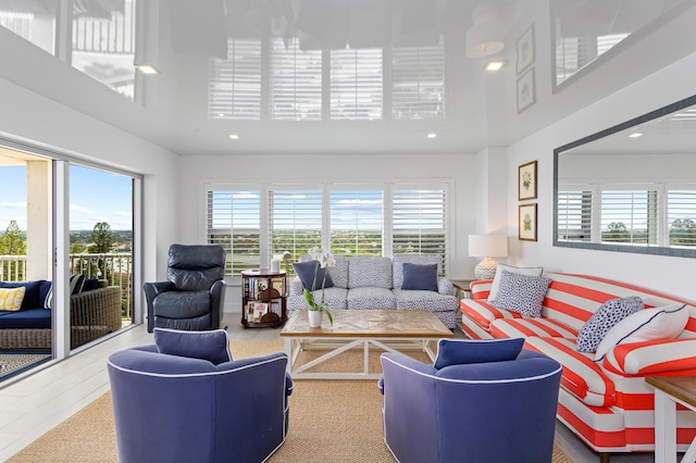 living room featuring a towering ceiling