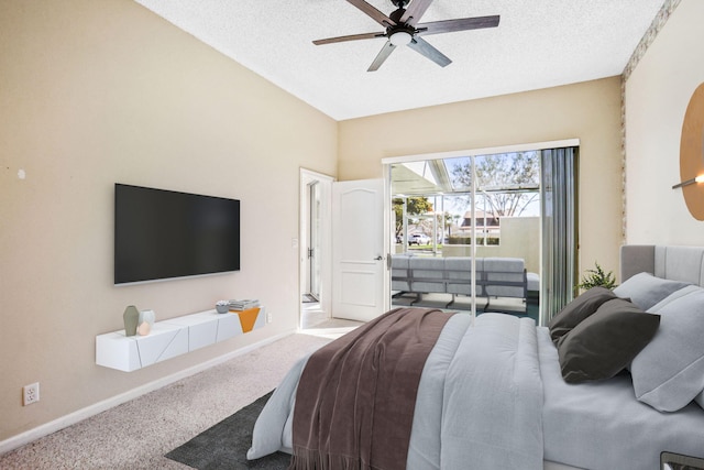 bedroom with a textured ceiling, carpet flooring, and ceiling fan