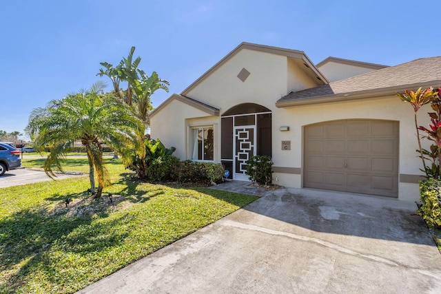 view of front facade with a front lawn and a garage