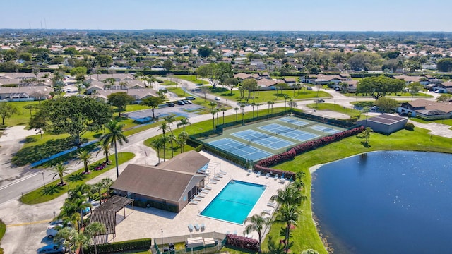 birds eye view of property with a water view