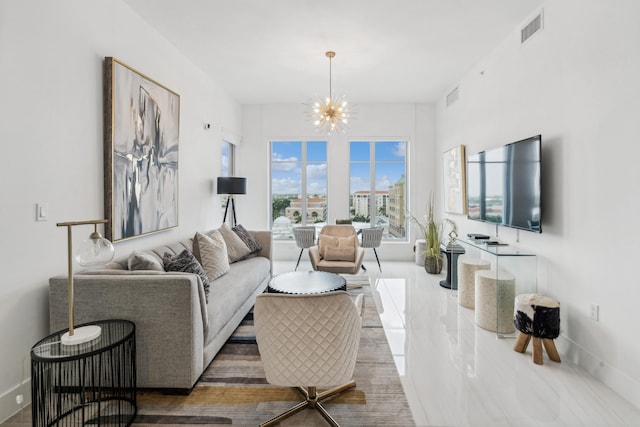 tiled living room featuring an inviting chandelier