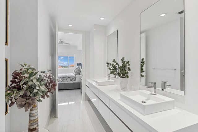 bathroom with tile patterned flooring and vanity