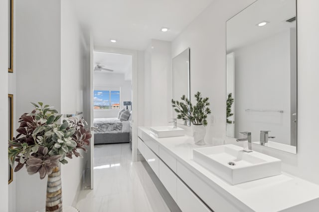 full bath with double vanity, visible vents, a sink, and ensuite bathroom