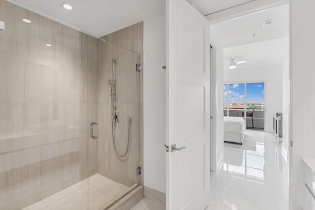 bathroom with tile patterned floors, walk in shower, and ceiling fan