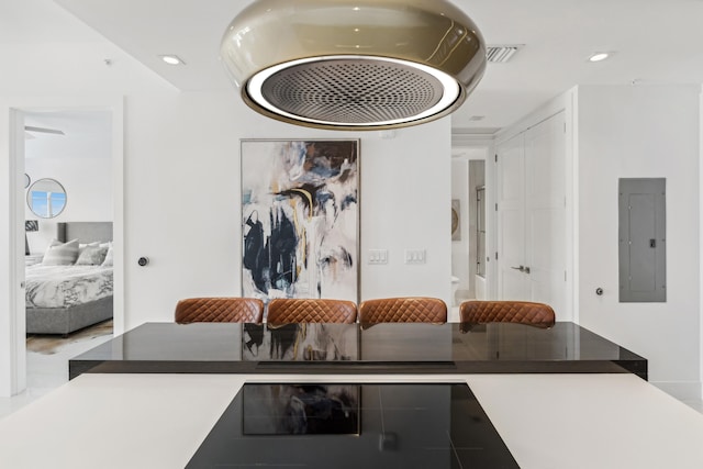 interior space featuring recessed lighting, electric panel, and visible vents