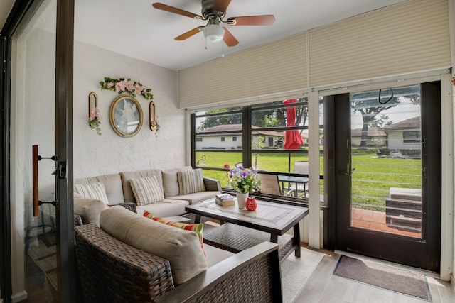 sunroom / solarium featuring ceiling fan