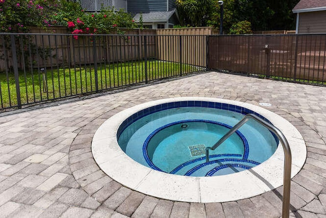 view of pool featuring an in ground hot tub and a patio area