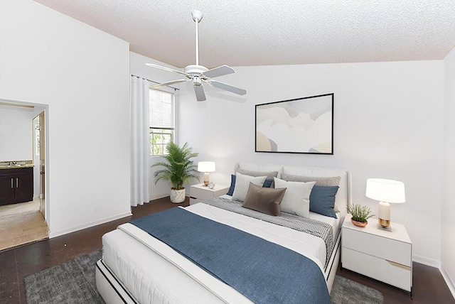 bedroom featuring a textured ceiling, dark wood-type flooring, ceiling fan, and lofted ceiling