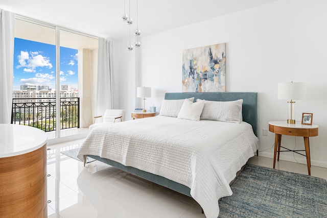 tiled bedroom featuring access to outside