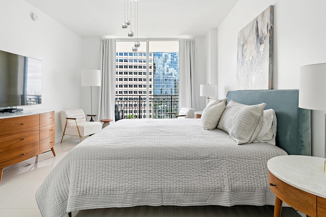 bedroom featuring a wall of windows